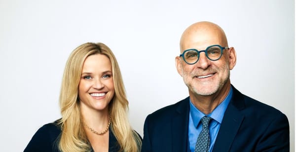 Reese Witherspoon Teams up with a Mystery Man